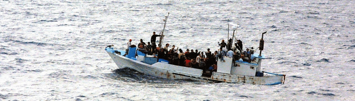 Barca con migranti